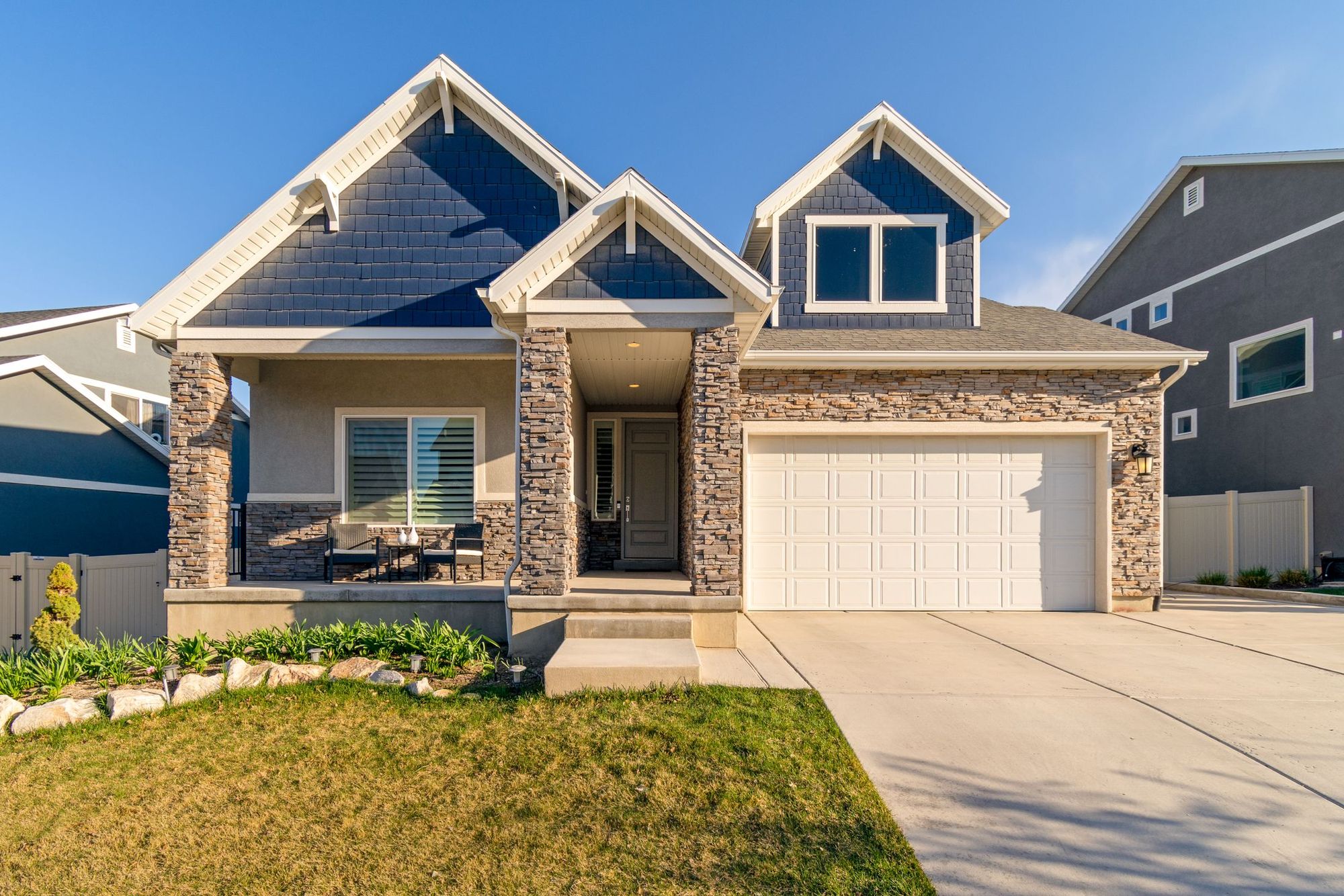 Suburban home with a stone facade and a new front porch