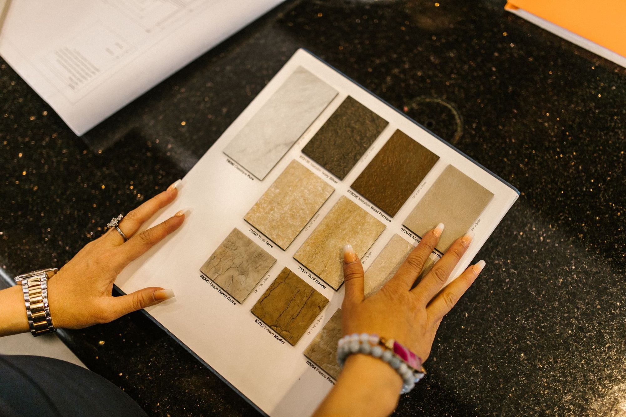 Cabinet doors, tile and countertop samples laid out during the design phase
