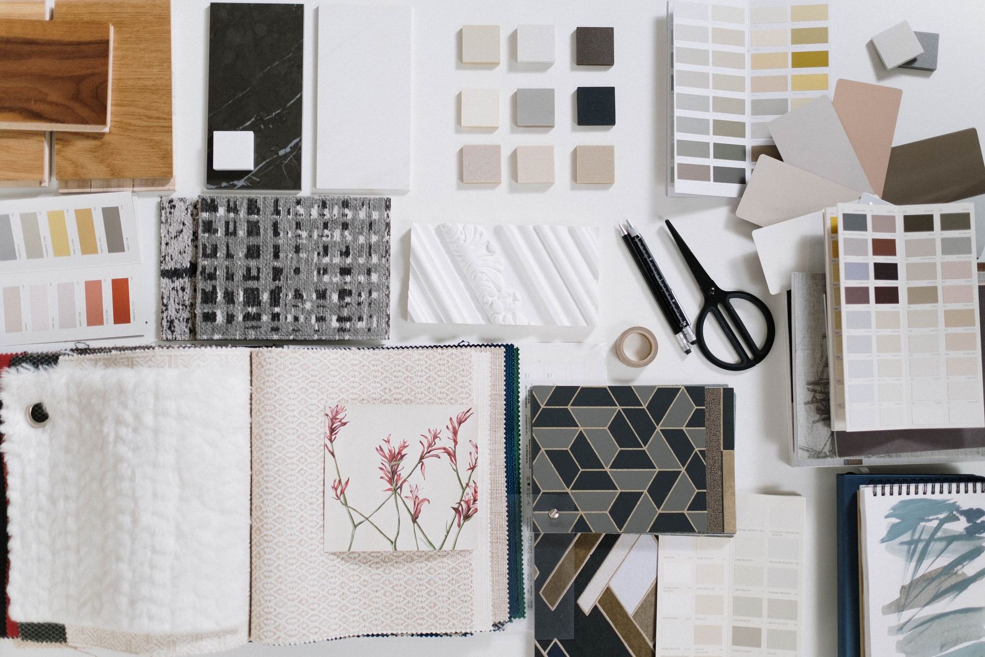 Cabinet doors, tile and countertop samples laid out during the design phase