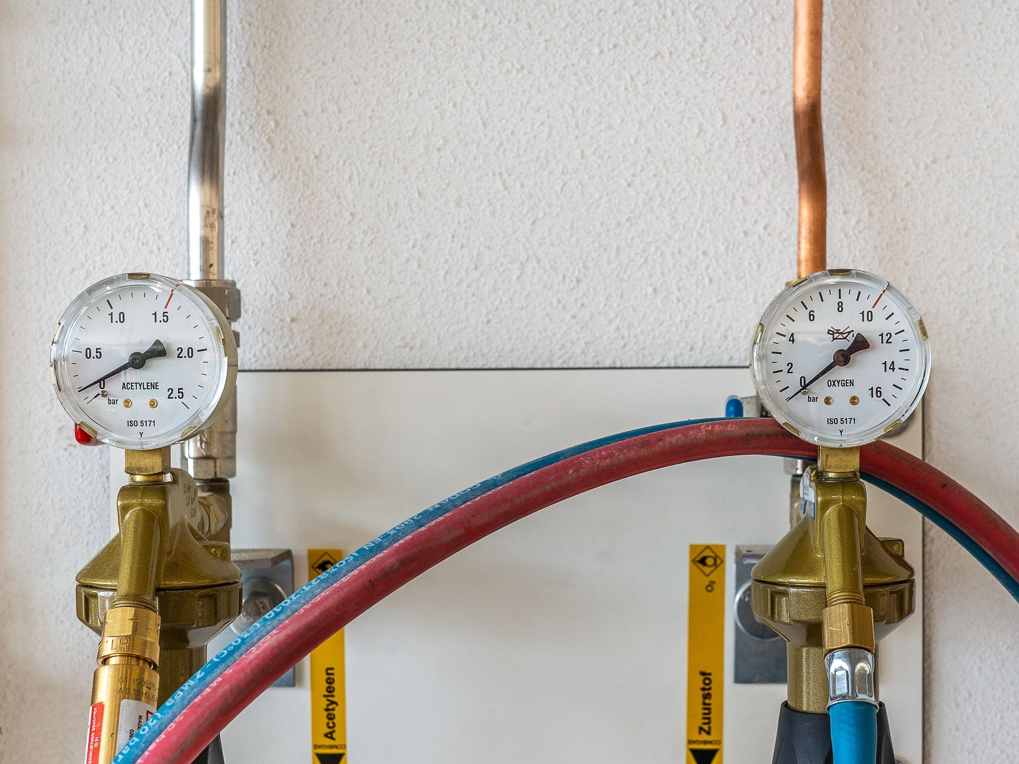 Pressure gauges on a copper supply line during a test