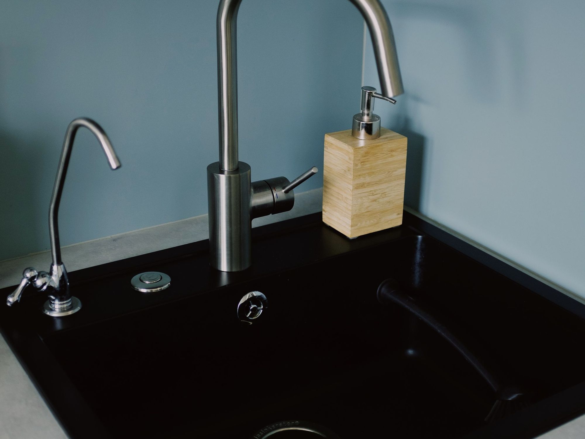 Stainless faucet and sink in a bright kitchen