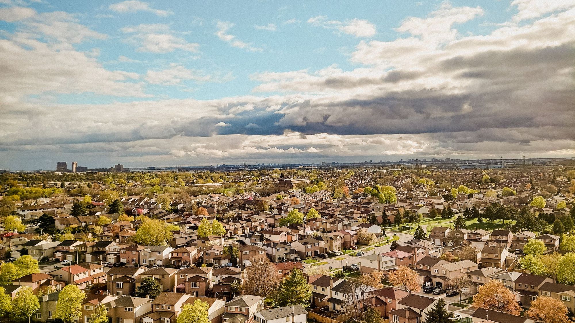 Aerial view of a north Mecklenburg subdivision with shingle roofs
