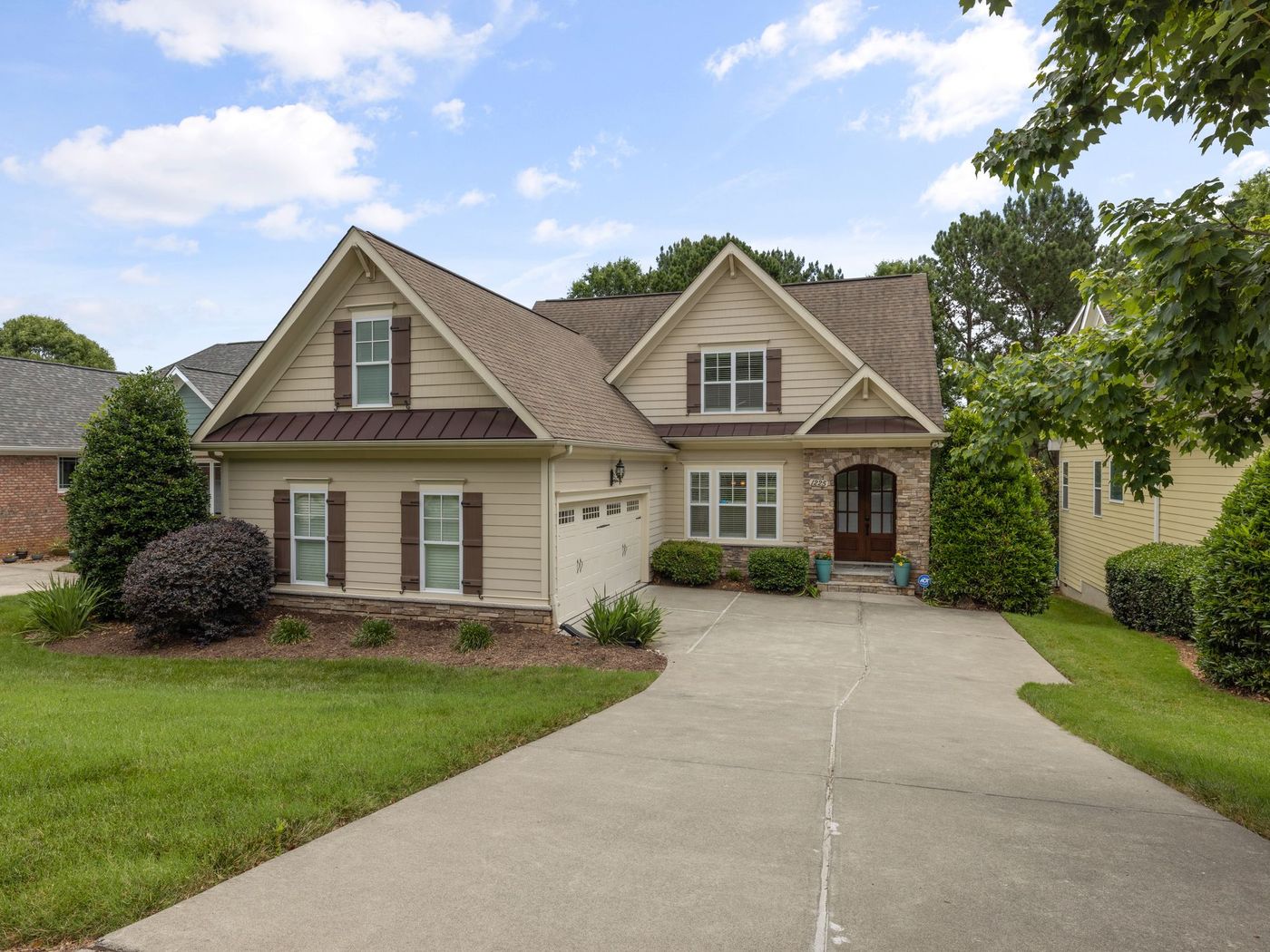 Craftsman style house with dormers and a new shingle roof