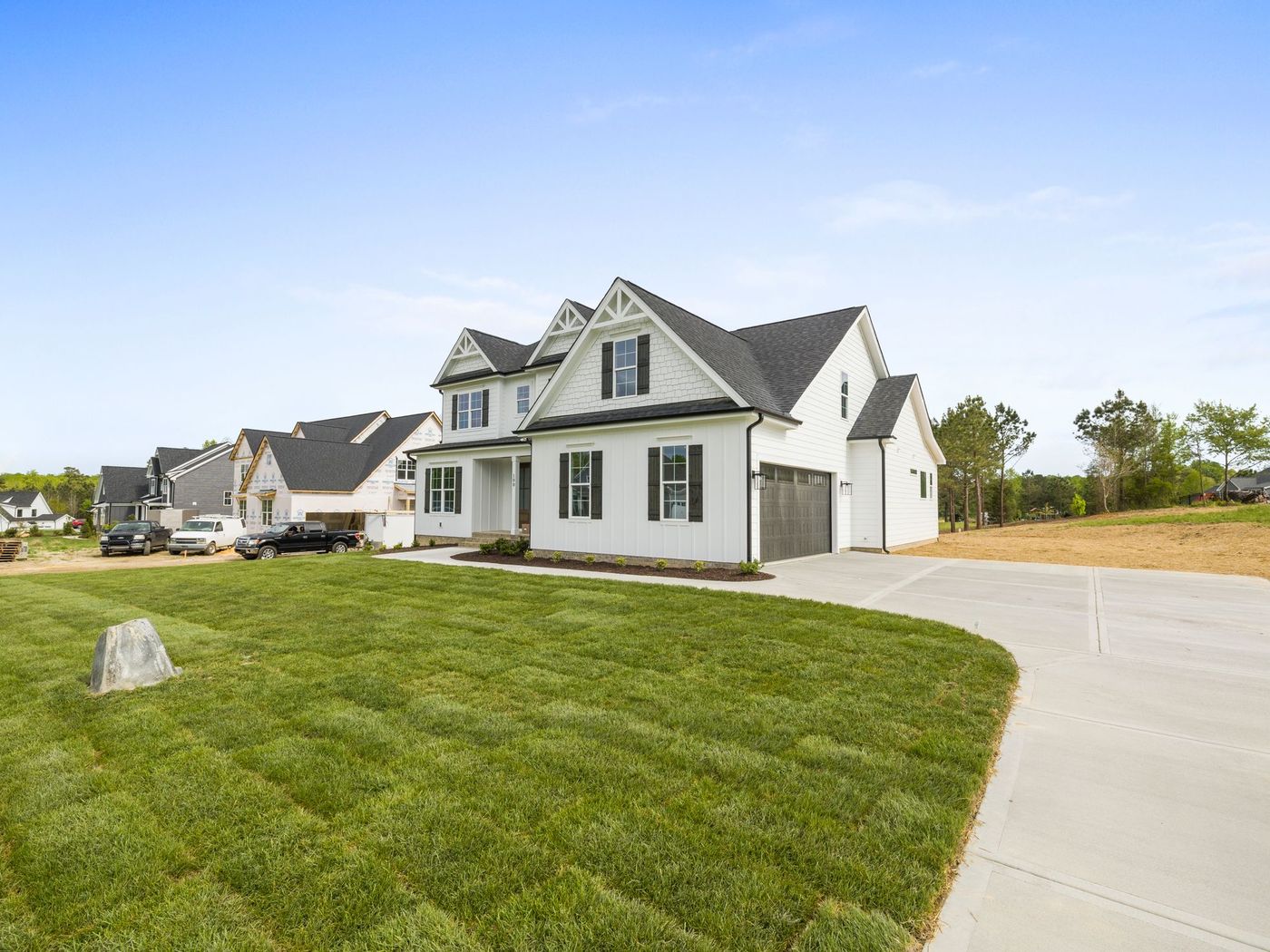 Large suburban home with multiple roof planes and valleys